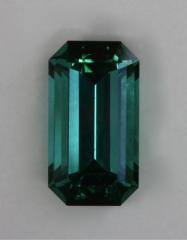 Blue to green medium toned emerald cut