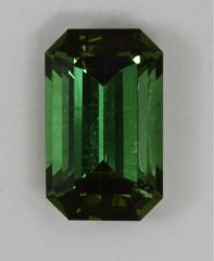 Lightly included green emerald cut with closed ends.