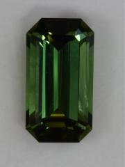 Classic yellow green emerald cut with closed ends.