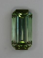 A fine emerald cut that is eye clean and slides from colorless to green.