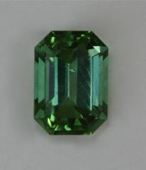 Smaller bright blue green emerald cut.