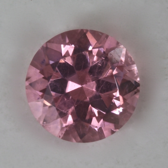 A baby, pastel pink that is eye clean round.  #20