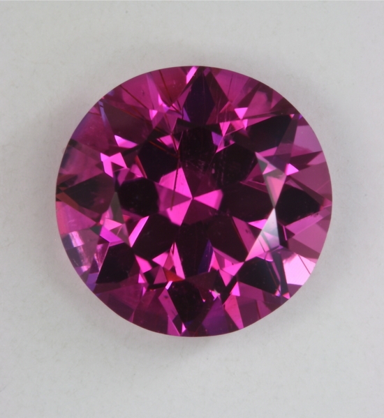 A hot, hot medium toned round with a few growth tubes.  #21