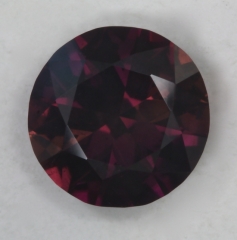 A brown droplet of color, that has violet flash in good lighting.  #68