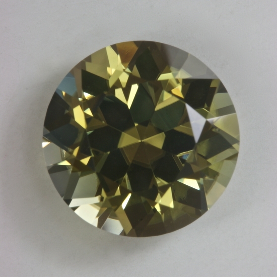 A bit toned down yellow with a wash of green, round.  #91