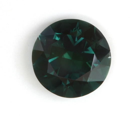 Darker toned, dull, blue green with moderate flash, round. #122