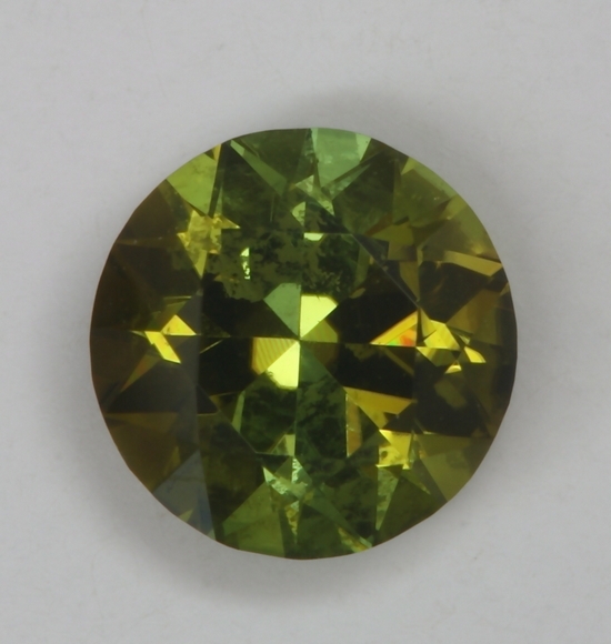 Incuded dichroic golden green/green round.  #153