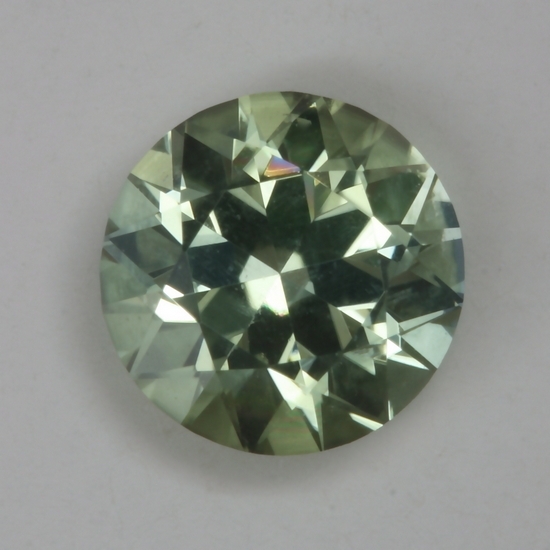 Pale yellow washed with green droplet of color.  #154