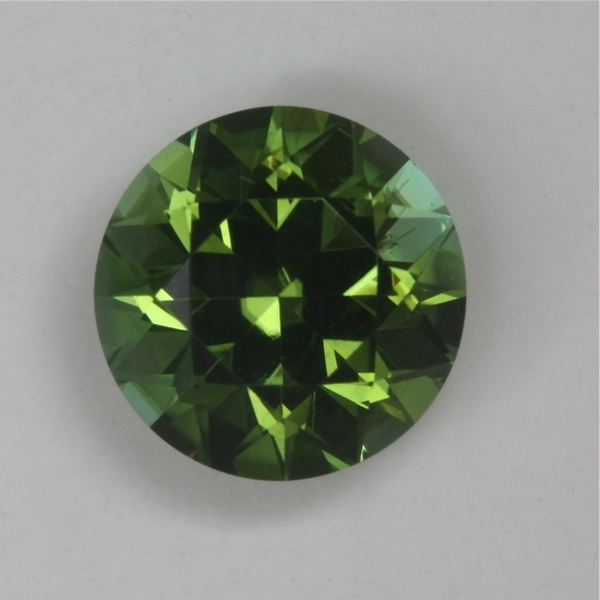 In natural light, this has a touch of blue in the green round.  #181