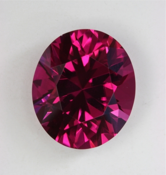 Rich sultry red pink that is eye clean and powerful, oval  #295