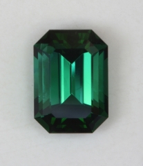 Medium dark blue with overtone of green, emerald cut.#367