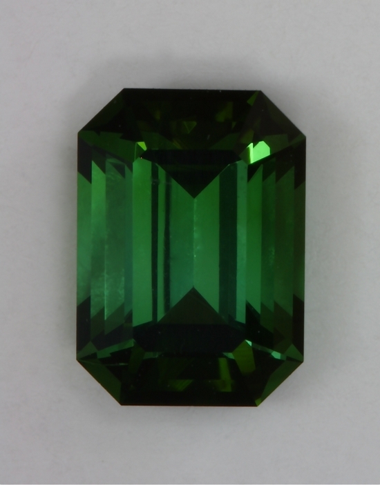 Small snappy green emerald cut with semi closed   #402.