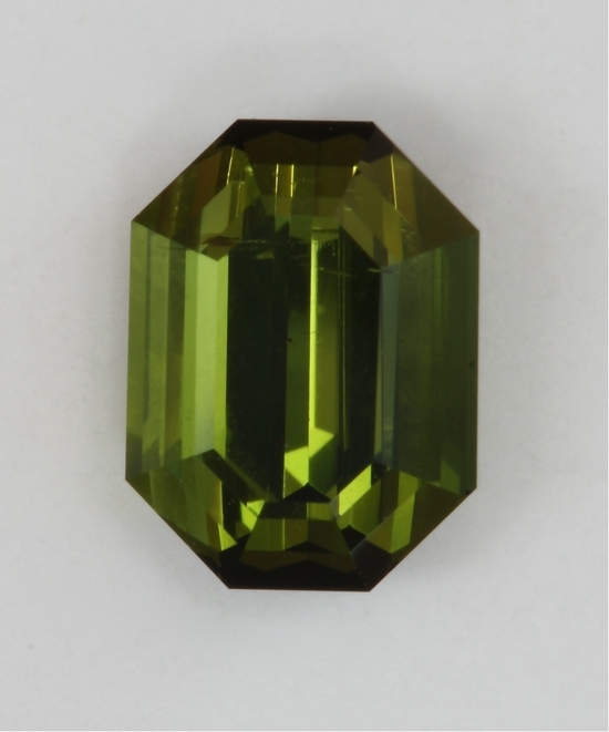 closed ended emerald cut with golden green olive color.  #437
