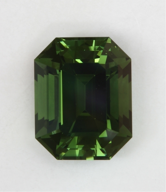 An emerald cut with its table perpendicular to the c axis, limited green flash  #445