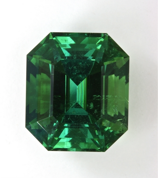 Slightly included, large, bright flashy green emerald cut, Afghanistan.  $446