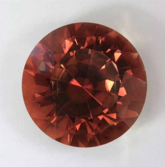 This is a GEM with a great orange color that has a secret, round  #791