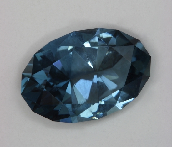 A fine medium pastel blue color without a hint of green, but with a touch of gray, oval.  #809