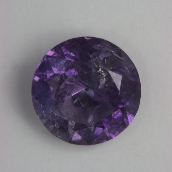 Included Laurellite, blue to purple color changer, cuprian, round.