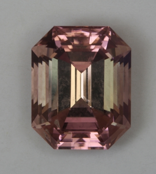 Medium light, peach pink, eye clean, emerald cut.
