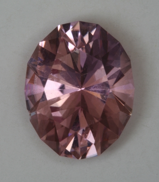 Nice pastel baby pink, eye clean oval.