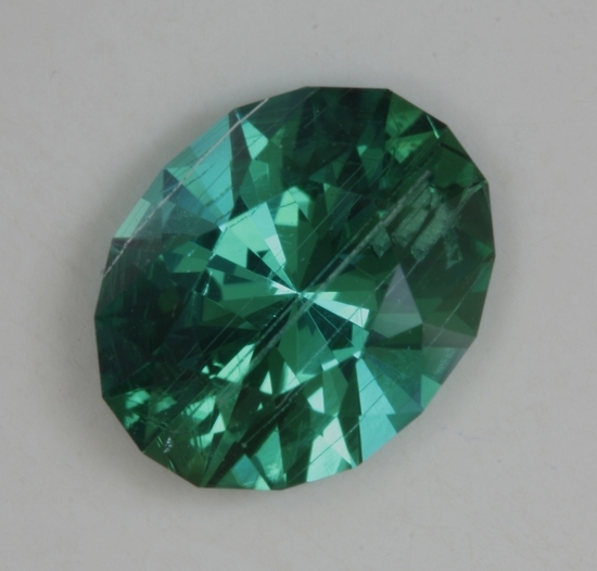 Great blue green color with a few growth tubes oval.