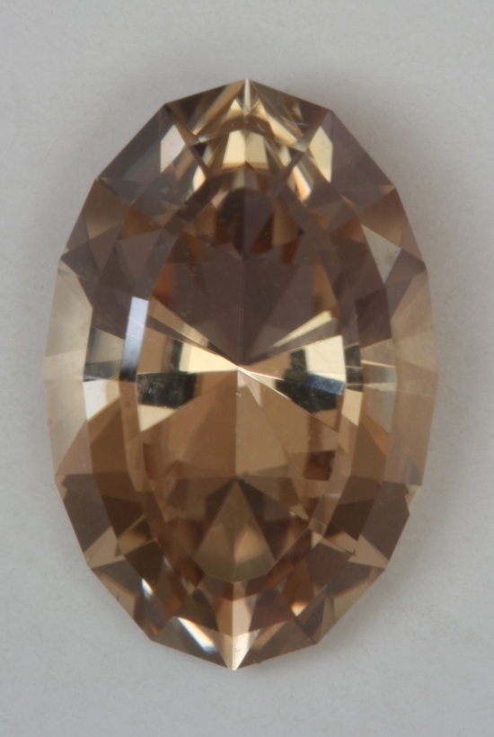 Medium light pastel peach long ratio oval.