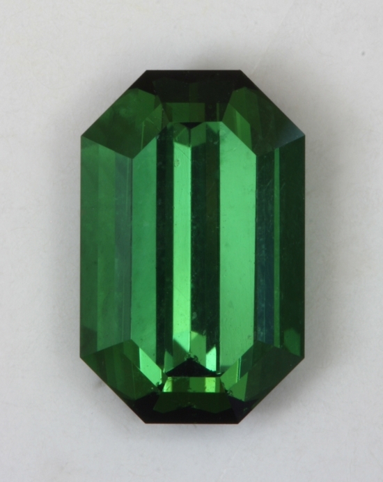 Nice flashy green emerald cut with closed ends.