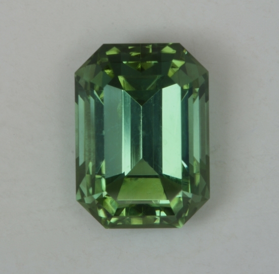 A fine completely open medium pastel green with touch of blue emerald cut.