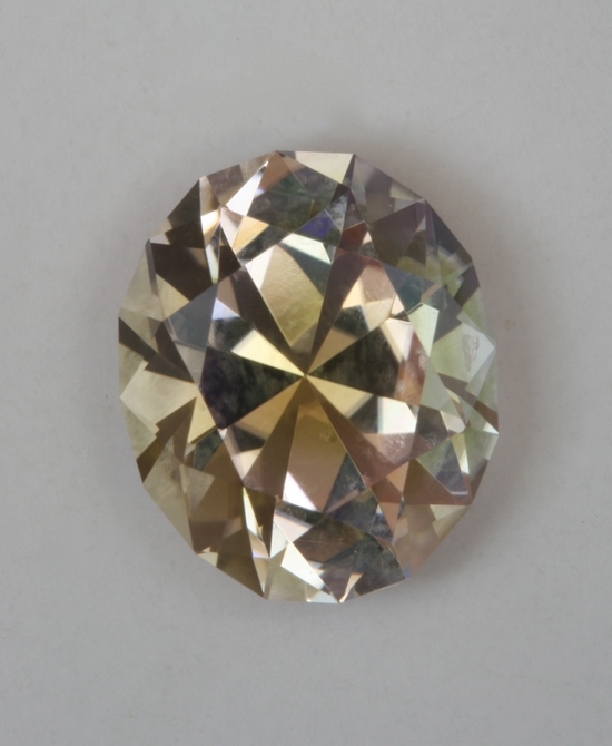 Bright pink with a bit of yellow green in the pavilion, oval.