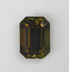 Smaller emerald cut with green c axis and yellowish brown a/b axis