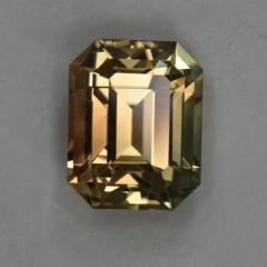 Bright yellow eye candy with orange shadow, emerald cut.