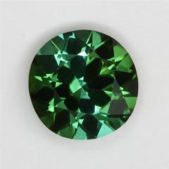 Subtle mixture of darker dichroic greens, droplet of color.