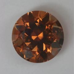 A browned pastel orange, bit of chipping on the pavilion. round