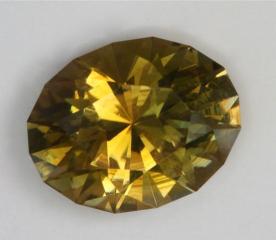 Dichroic yellow green with gold, touch of brown oval.