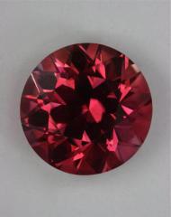 Medium dark toned red orange round.