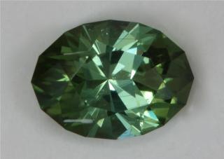 Slightly flawed forest green oval.