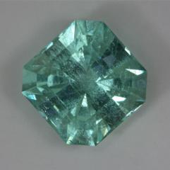 Bright included blue green square Barion cut.