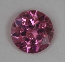 Slilgihtly included pretty hot pink dot of color.