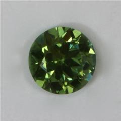 Smaller, round dot of medium toned green.