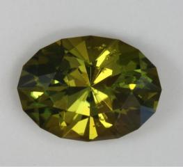 Darker, dichroic yellow green oval
