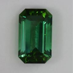 Slightly included emerald cut with a bright, spicy green color.