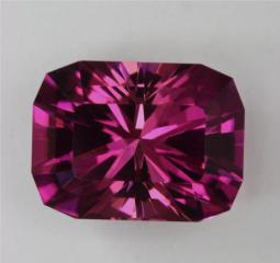 Medium Dark Toned Dichroic Pink Barion Cushion Cut.