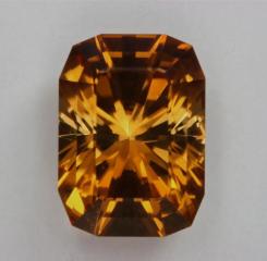 A great dichroic orange Barion Cushion with stepped crown.