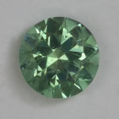 Slightly included fine green droplet of color.