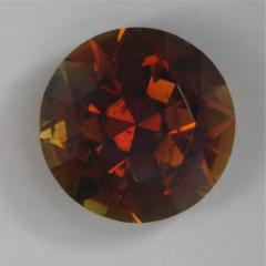Included, darkly toned, browned orange, round.