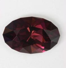 Dark brown with flashs of purple oval.