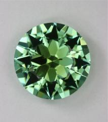 Nice dichroic green with a few inclusions deep in the stone.