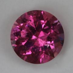 Visibly included,  bright, hot medium toned pink, round.