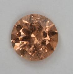 Slightly included peach droplet of color.