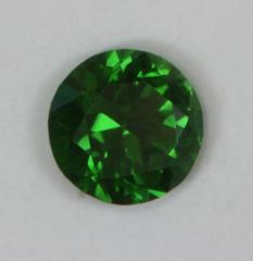 Tiny, dot of green with a touch of blue color..